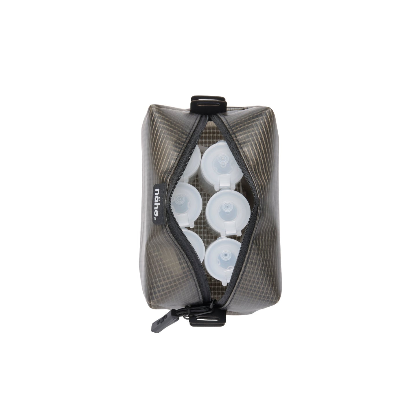Nähe Gray semi-transparent grid pouch, unzipped to show white pump bottles packed inside.