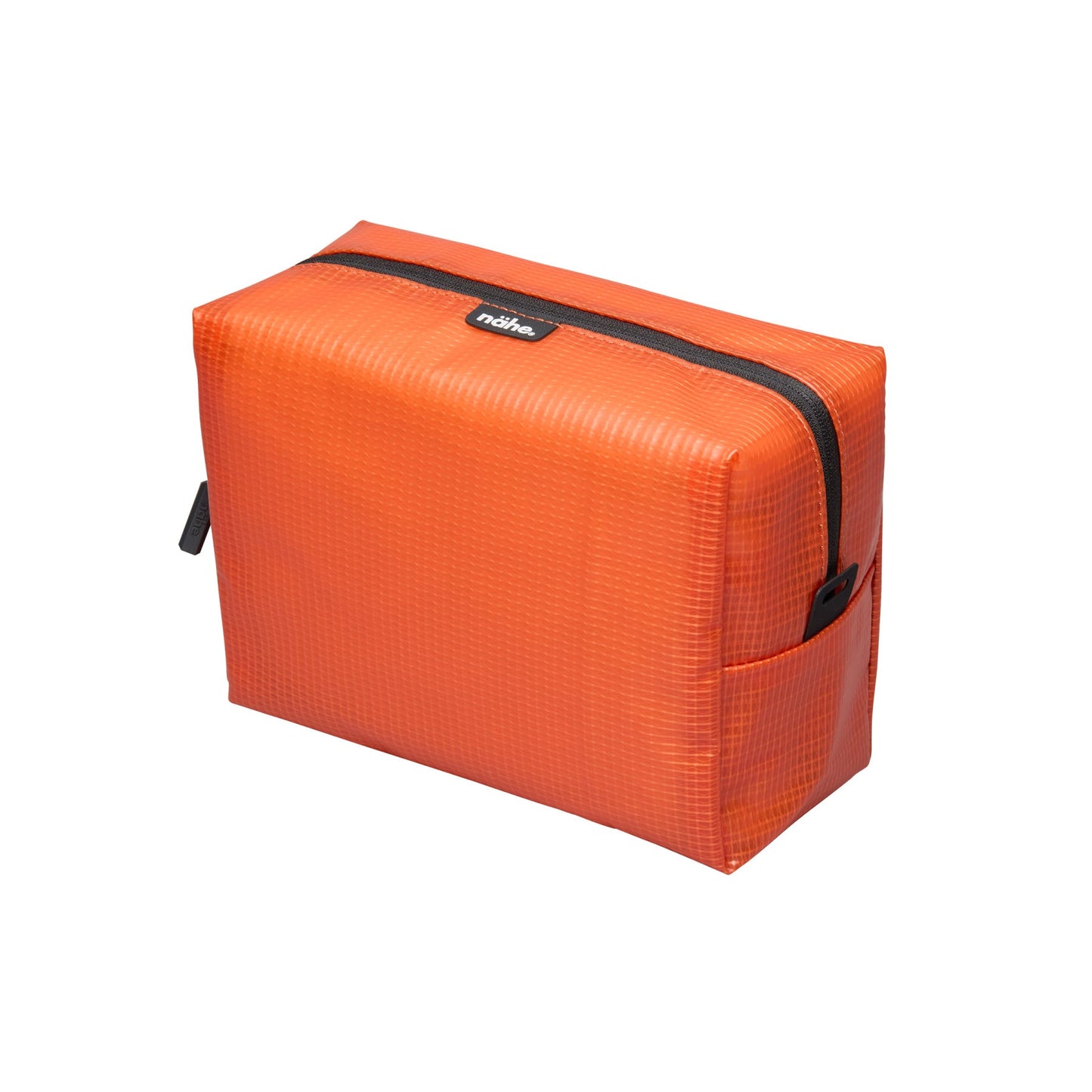 Nähe Soft Grid Pouch in Orange, a boxy grid-textured zip pouch with black zipper and side pocket